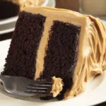 Moist chocolate peanut butter cake mix with creamy frosting on a white plate