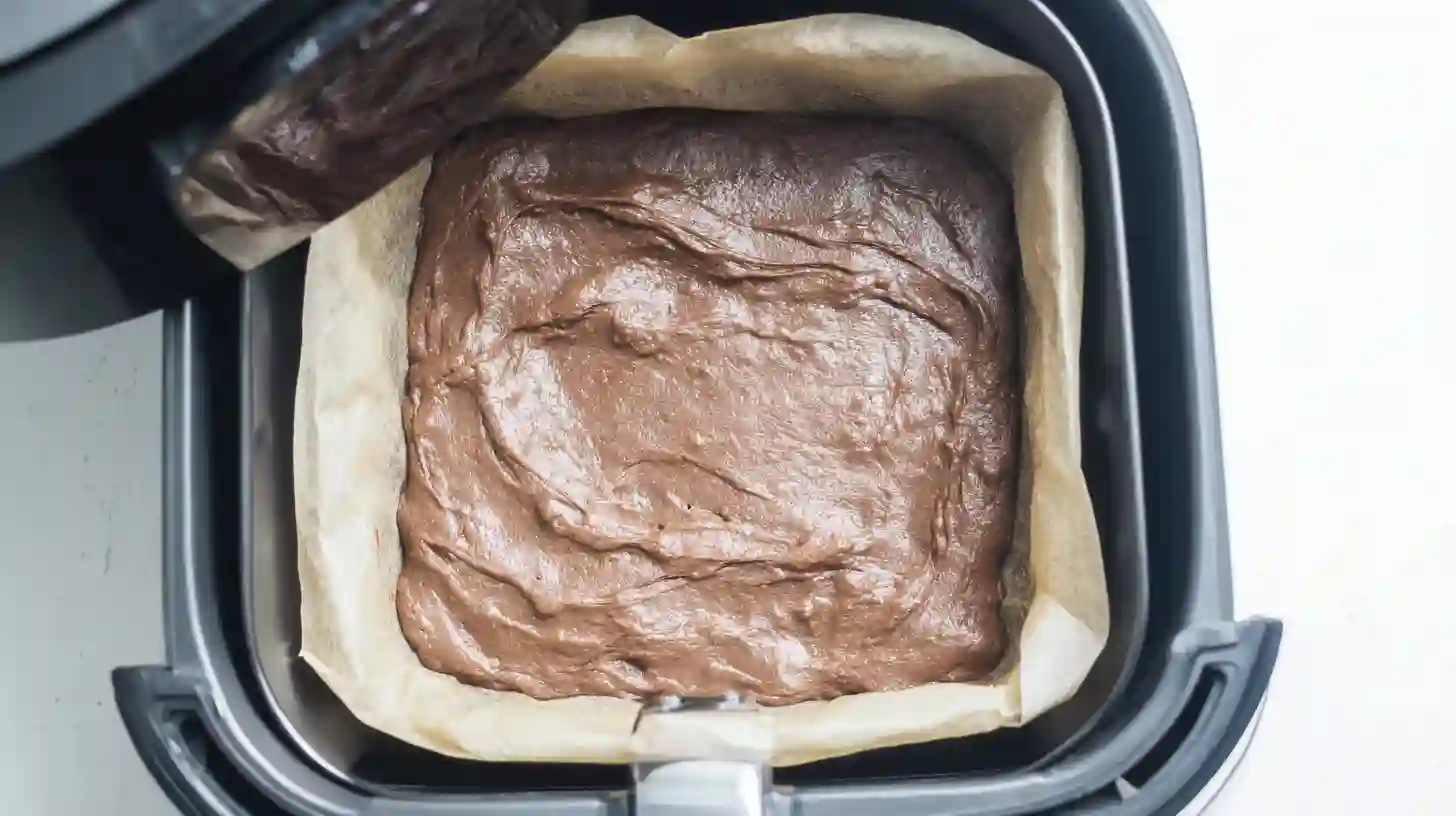 step-3-bake-air-fryer-brownies Best air fryer for baking brownies with evenly spread batter for two ingredient air fryer brownies recipe