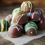 Chocolate-covered Easter egg truffles with colorful drizzle