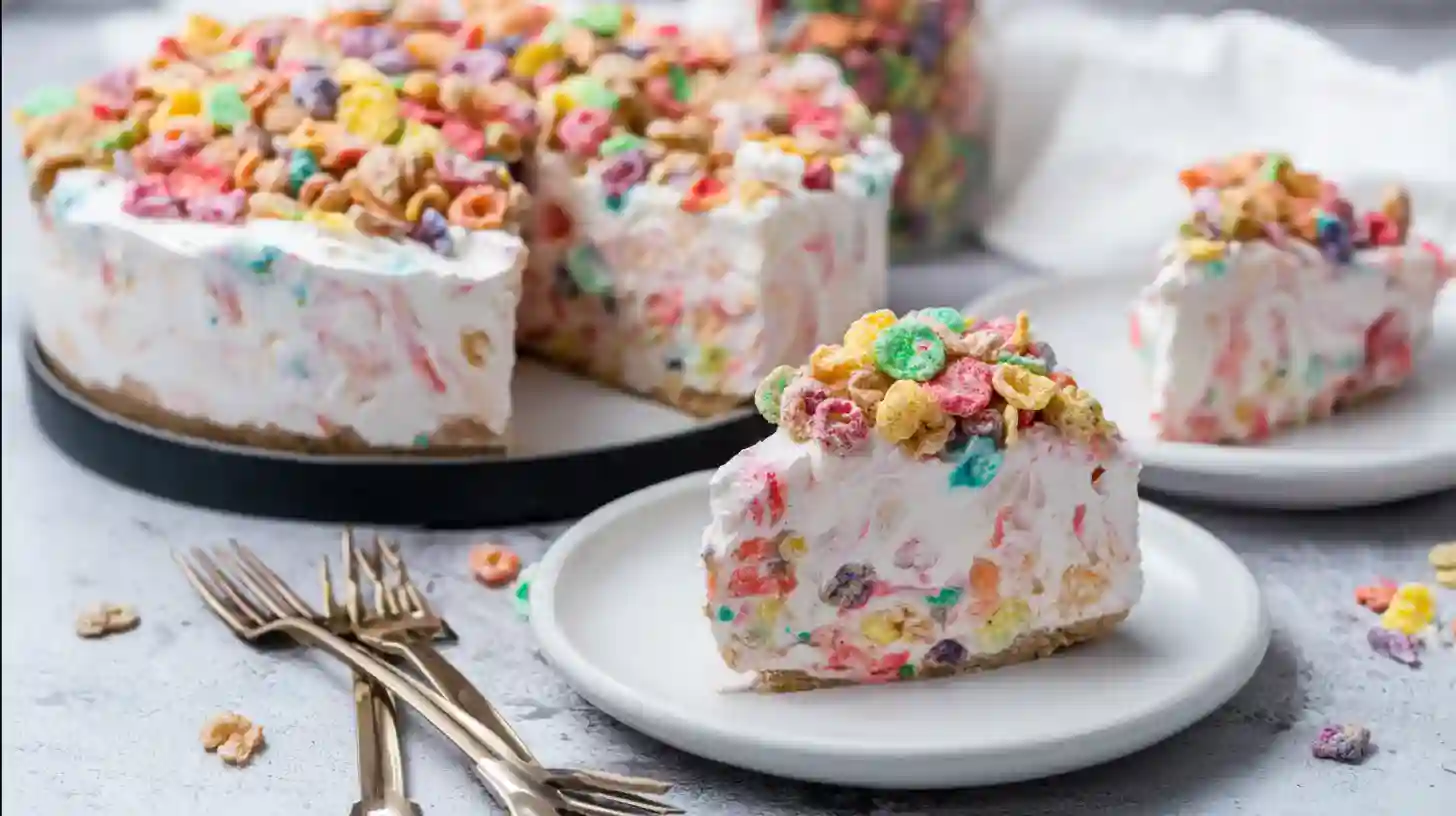 fruity-pebbles-no-bake-cheesecake-serving Fruity Pebbles cheesecake slice served on plate