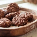 Protein no bake cookies on a wooden tray