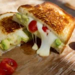 sliced avocado mozzarella tomato grilled cheese sandwich