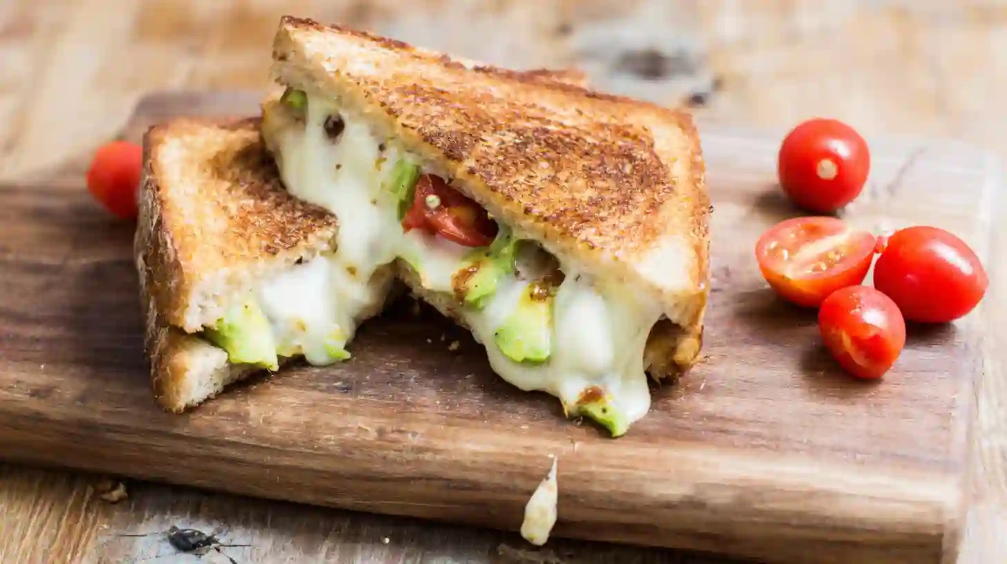 avocado-mozzarella-and-tomato-grilled-cheese-featured2 Avocado Mozzarella and Tomato Grilled Cheese sandwich sliced image 1