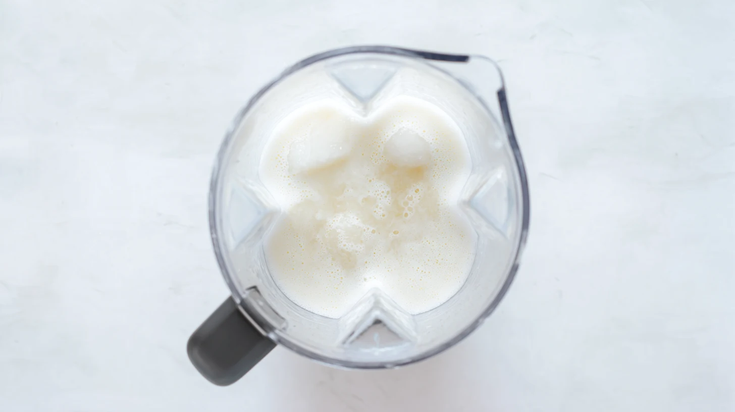 blending-tropical-sherbet-base blending pineapple juice and coconut cream for mocktail
