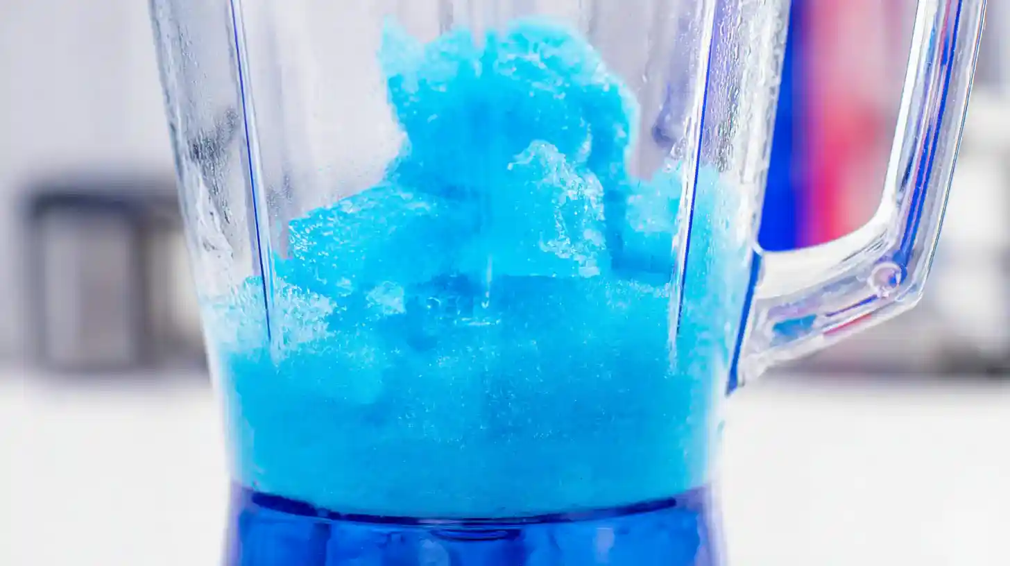 blue-curacao-slush-step Blue curaçao slush being blended for cocktail base