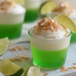 Coconut Lime Daiquiri Jello Shots with cream and lime