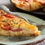 Comforting Bacon Onion Tomato Pie with golden cheese crust