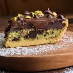 Served slice of Easy Dubai Style Chocolate Cookie Pie with pistachio and ganache