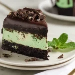 Served slice of Easy Mint Chocolate Cheesecake Cake on plate