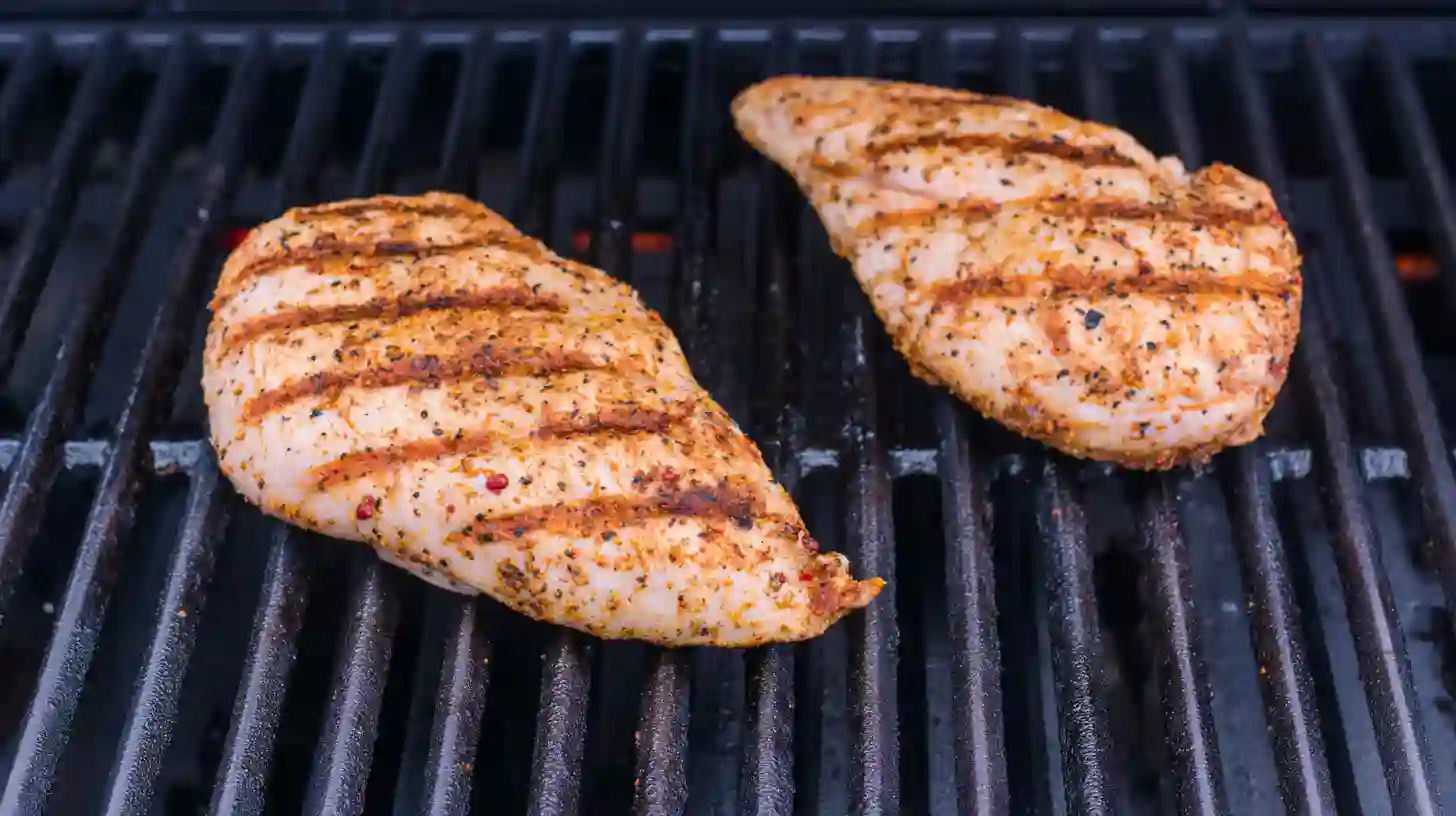 grilling-chicken-for-blt-salad. chicken breasts Grilled Chicken & Bacon Cucumber BLT Salad
