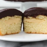 Sliced Heavenly Boston Cream Cupcakes with filling visible