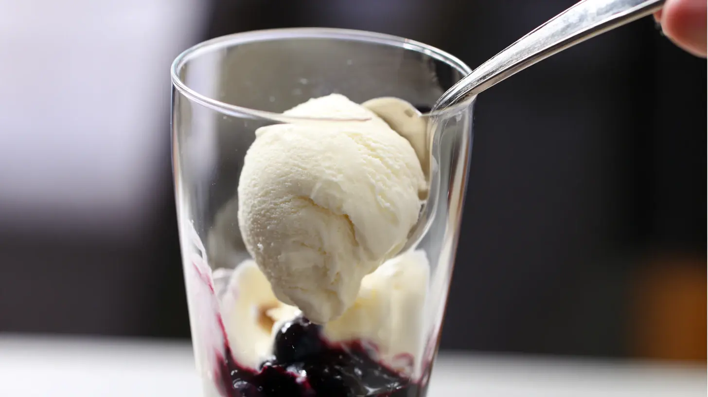 layering-blueberry-vanilla-parfait layering vanilla ice cream and blueberry sauce into glass