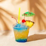 Malibu Mermaid Bucket Cocktail served with fruit and umbrella