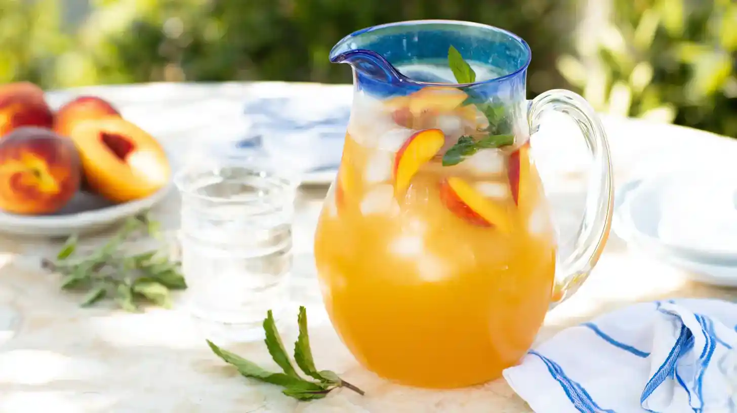 ocean-peach-punch-featured Ocean Peach Punch in pitcher with mint and fruit