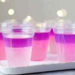 pink pony vodka jello shots layered in clear cups