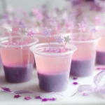 Pink Pony Vodka Jello Shots in party setting with glitter in clear 2 oz plastic cups