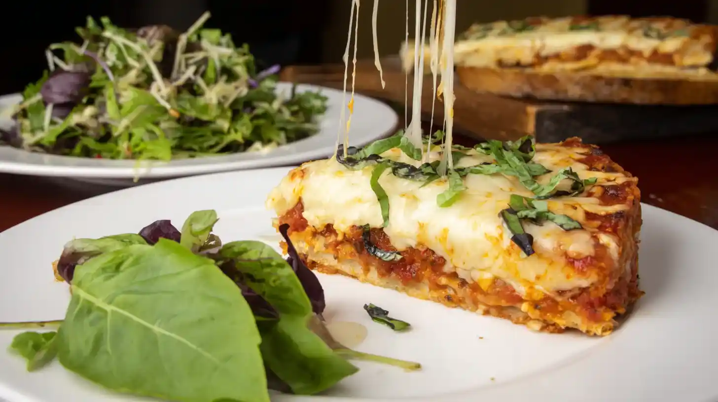 pizzagna-italian-fusion-Bake-Recipe-served Sliced Pizzagna Italian Fusion Bake Recipe served with basil and a side salad