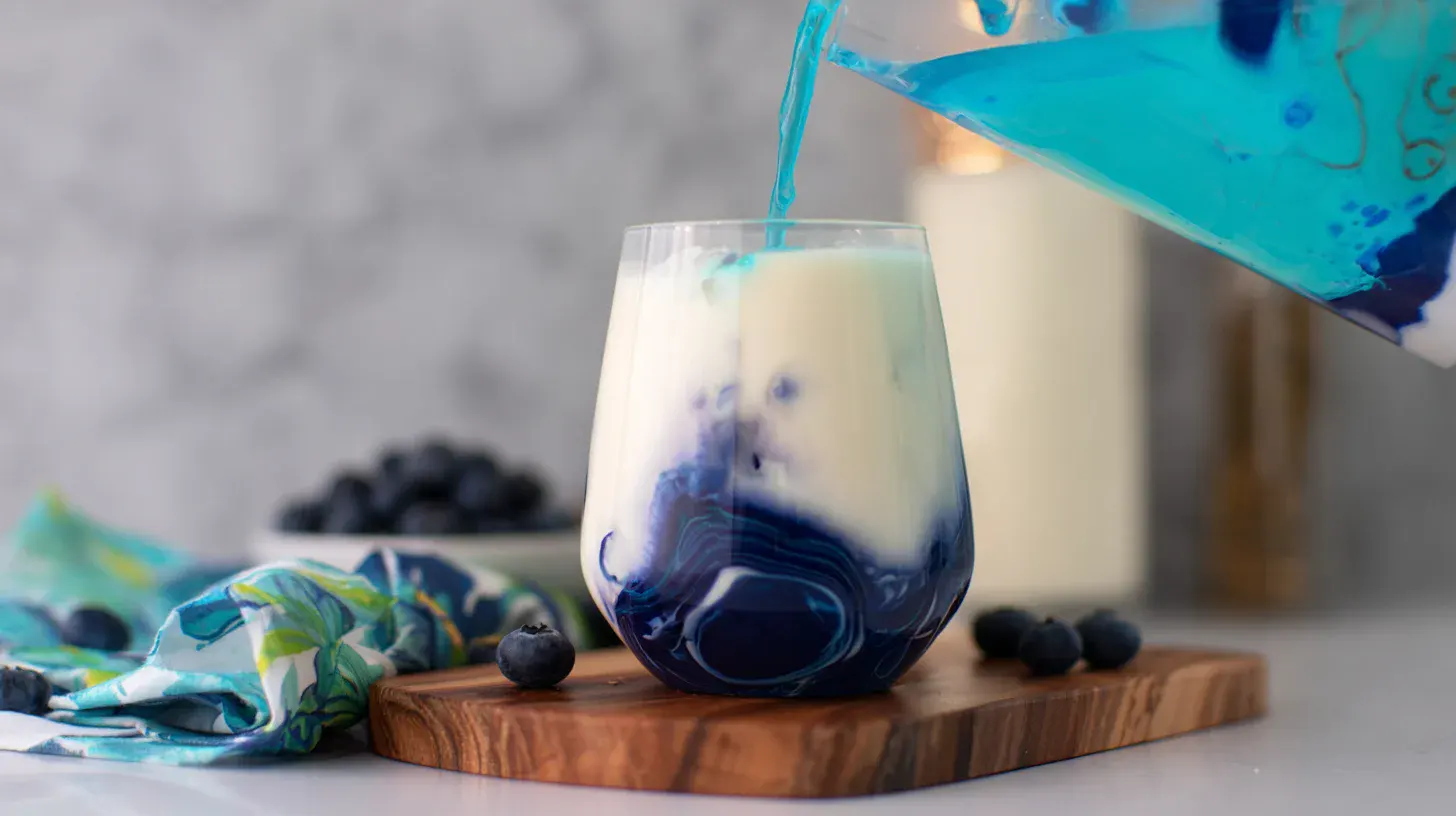 pour-drizzle-ocean-love-colada Pouring and drizzling Ocean Love Colada with blue curaçao for deep sea color