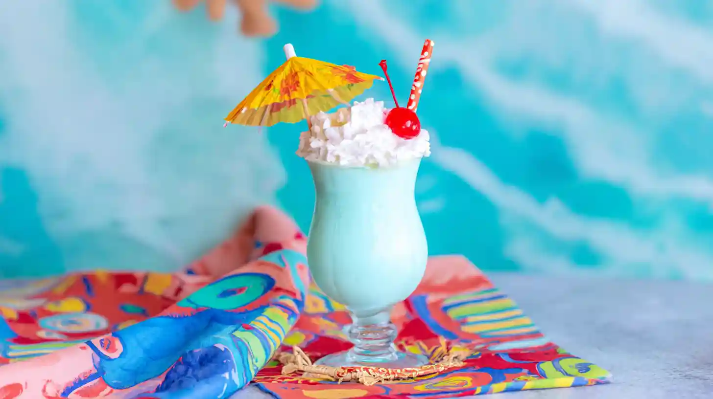 served-ocean-blue-Piña-colada Served ocean blue piña colada with tropical garnish
