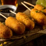 Shrimp and crab nacho bomb corn dogs recipe featured image