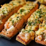 Golden Simple crab and shrimp stuffed salmon sliced and served on a black dinner plate