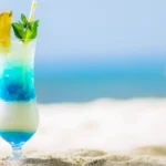 Tropical Galaxy Mocktail with layered blue and white swirl in tall glass