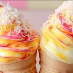 Serving Bahama Mama Ice Cream with coconut and cherry topping.low carb ice cream alternatives