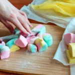 Cutting and wrapping pastel Homemade Saltwater Taffy Rolls