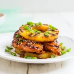 Plated Hawaiian Huli Huli Chicken Stack – tropical chicken dinner idea with grilled pineapple and sesame seeds