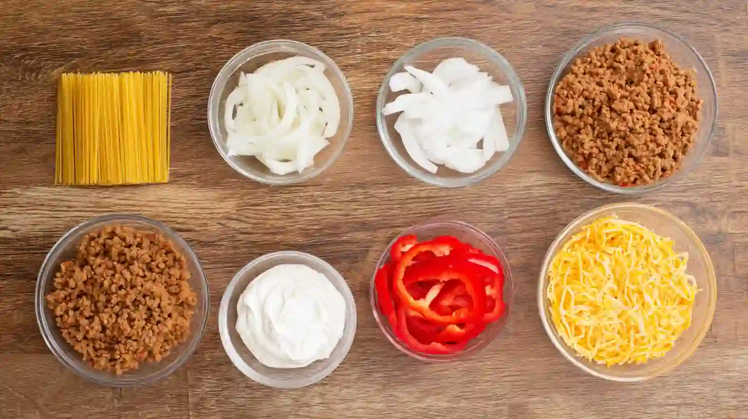 how-to-make-taco-spaghetti-easy-ingredients How to Make Taco Spaghetti Easy ingredients on a wooden counter