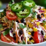 Layered Mexican Coleslaw Tomato Corn Salad with creamy lime dressing, corn, beans, tomatoes, and jalapeño.gluten-free summer salad