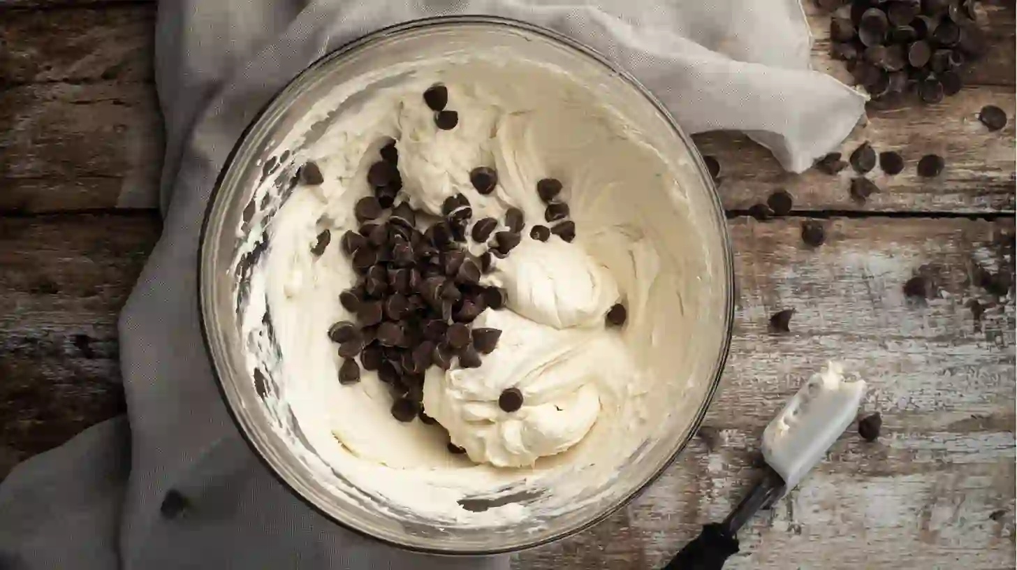 prepare-filling-cheesecake-croffles Crispy Cheesecake Cookie Croffles filling with cream cheese, powdered sugar, and chocolate chips – viral croffle recipe and quick cheesecake-filled snack
