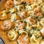Shrimp Tortellini with Lemon Garlic Cream Sauce in skillet.easy weeknight dinners for busy moms.high-protein meals for muscle gain