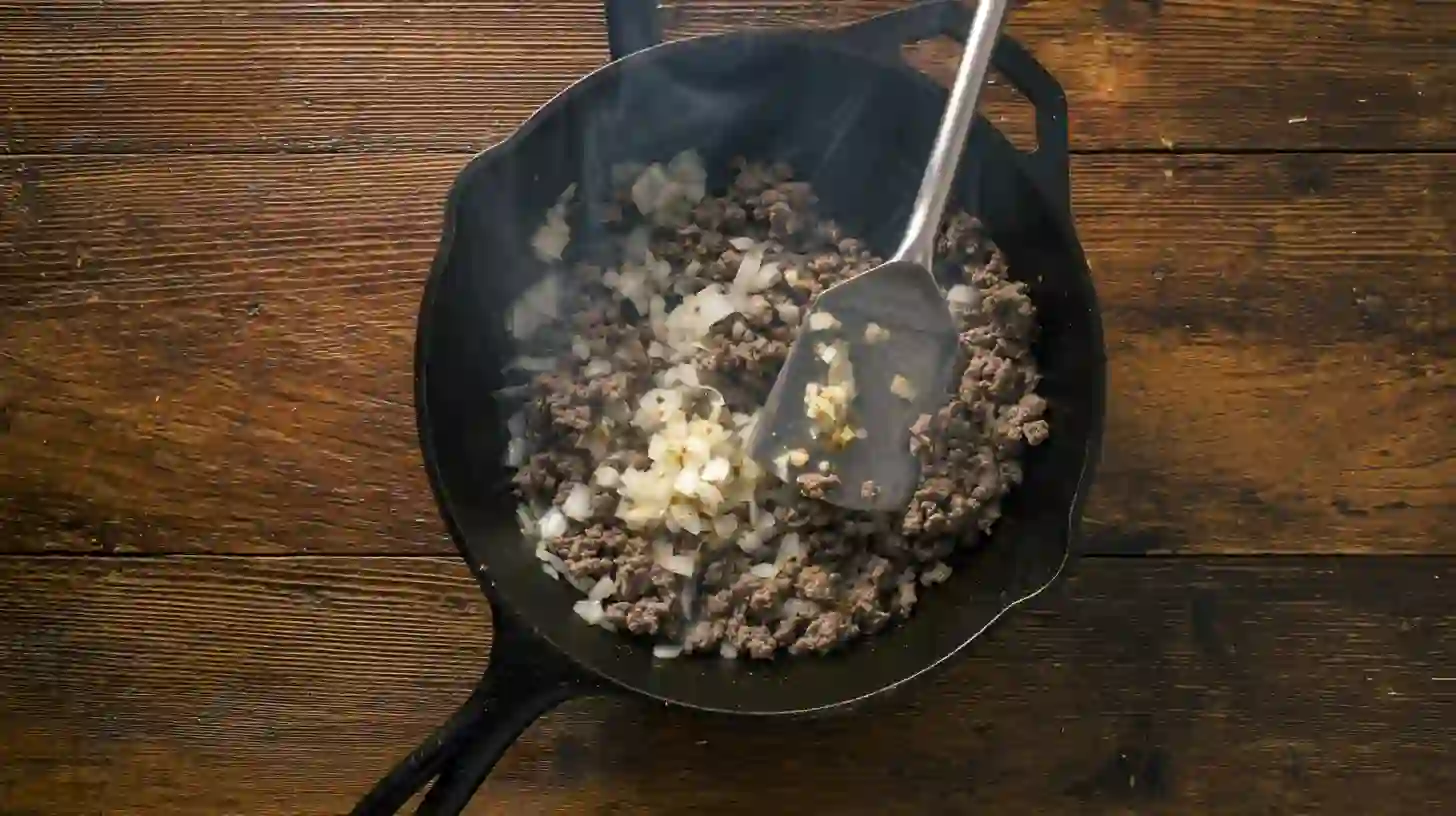 sloppy-joe-potato-skillet-cook-beef Cooking ground beef and onion for Sloppy Joe Potato Skillet – high-protein ground beef dinner for easy weeknight meals.budget ground beef