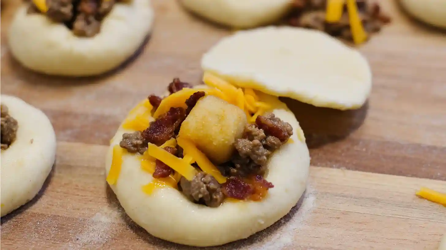 bacon-cheeseburger-loaded-mozzarella-stick-bombs-step3 Filling dough with beef, bacon, cheddar, and mozzarella for Bacon Cheeseburger Loaded Mozzarella Stick Bombs cheesy comfort food recipe