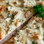 Best roasted garlic white chicken pizza finished with thyme, oregano, and parsley – sliced and ready to serve as an easy homemade Italian dinner.