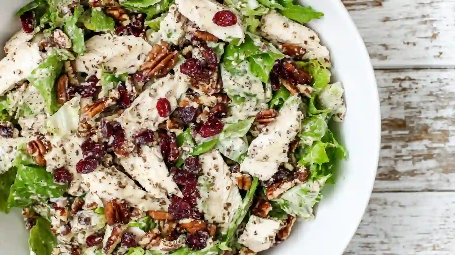 cranberry-pecan-chicken-salad-step4-finish-and-serve Cranberry pecan chicken salad with poppy seed dressing topped with extra cranberries and pecans – quick healthy dinner recipe for families