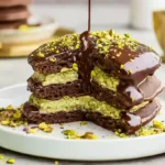 Stack of Dubai Chocolate Pancakes layered with pistachio filling and ganache – high-end dessert ideas for dinner parties