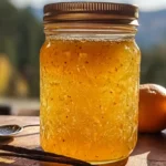 Featured Dreamsicle Jelly in mason jar with oranges and vanilla beans.Healthy breakfast spreads