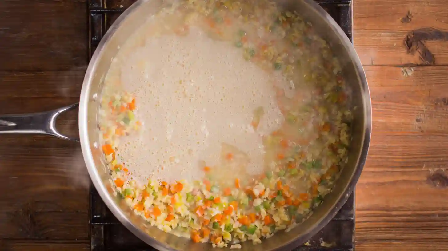 healthy-chicken-pot-pie-pasta-creamy-sauce Healthy Chicken Pot Pie Pasta creamy sauce – whisking broth and milk into sautéed veggies for creamy chicken pasta bake, healthy comfort food dinner