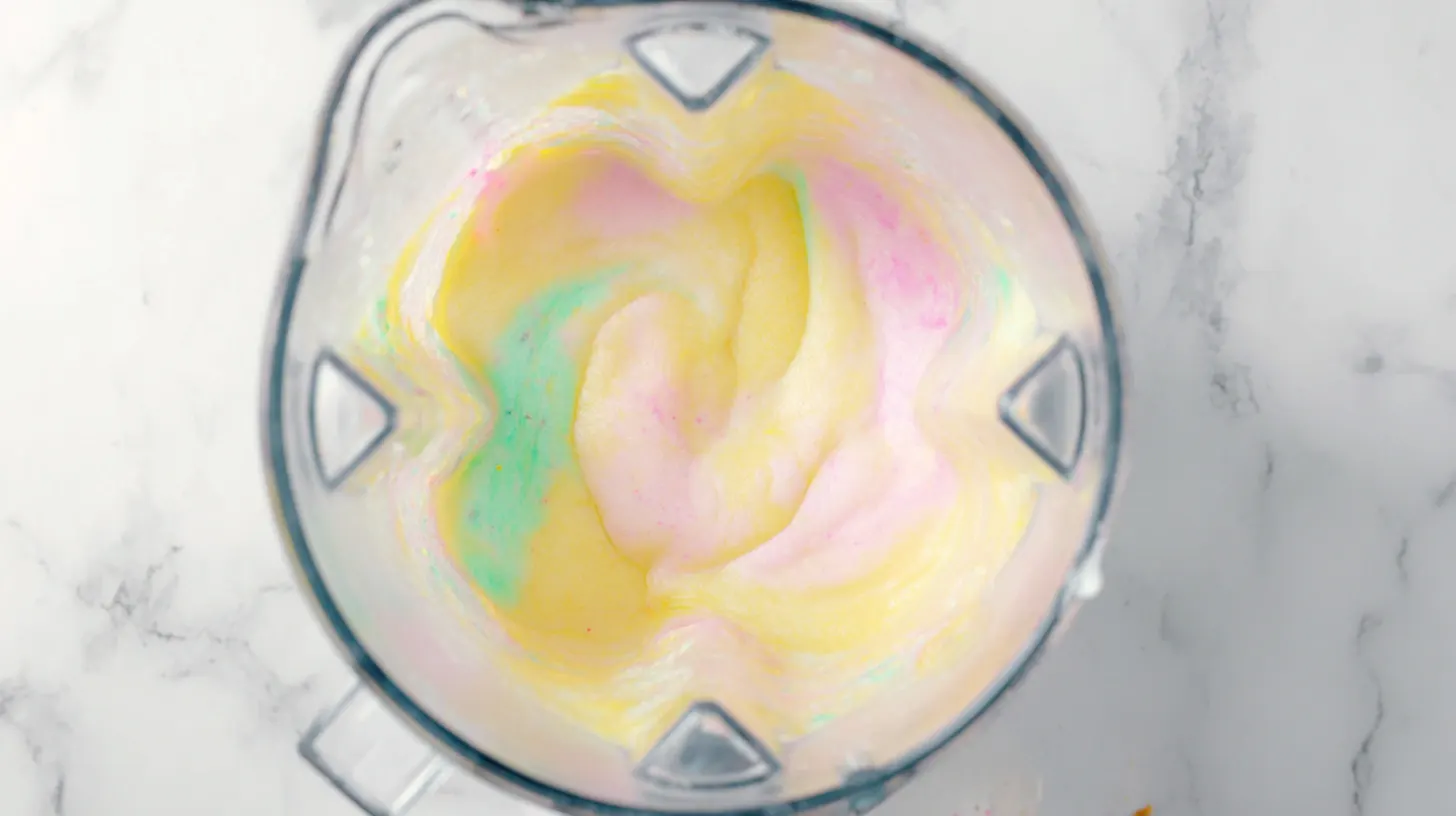 rainbow-sherbet-pina-colada-step-2-blended Rainbow Sherbet Piña Colada step 2 – blended creamy tropical drink with pineapple juice, coconut cream, and sherbet