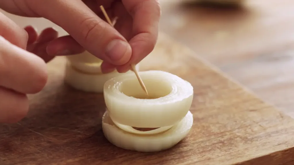 Assembling Cheesy Mozzarella Onion Rings with toothpicks for easy appetizer recipes and quick dinner prep
