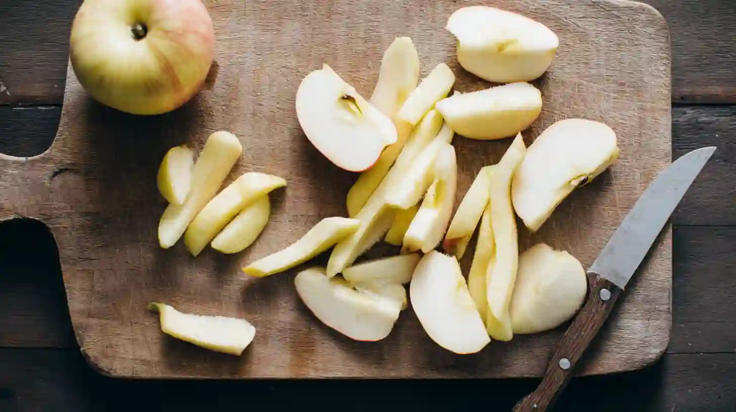 step2-prep-apples-crispy-air-fryer-apple-fries Step 2 Crispy Air Fryer Apple Fries recipe – peeling, coring, and slicing apples into fry strips for healthy air fryer snack ideas
