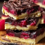 Best dark chocolate raspberry pie bars stacked with layers of chocolate, raspberries, and buttery crust.Luxury dessert recipes