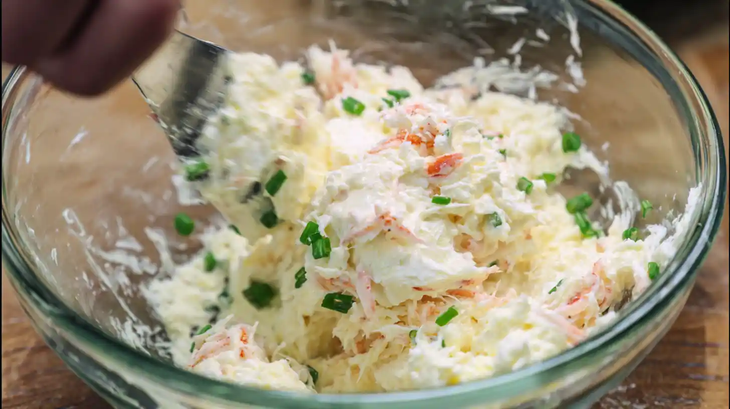 crab-rangoon-bombs-step1-mix-filling Mixing cream cheese, crab, and mozzarella for Crab Rangoon Bombs, easy seafood appetizer recipes and quick family dinner ideas