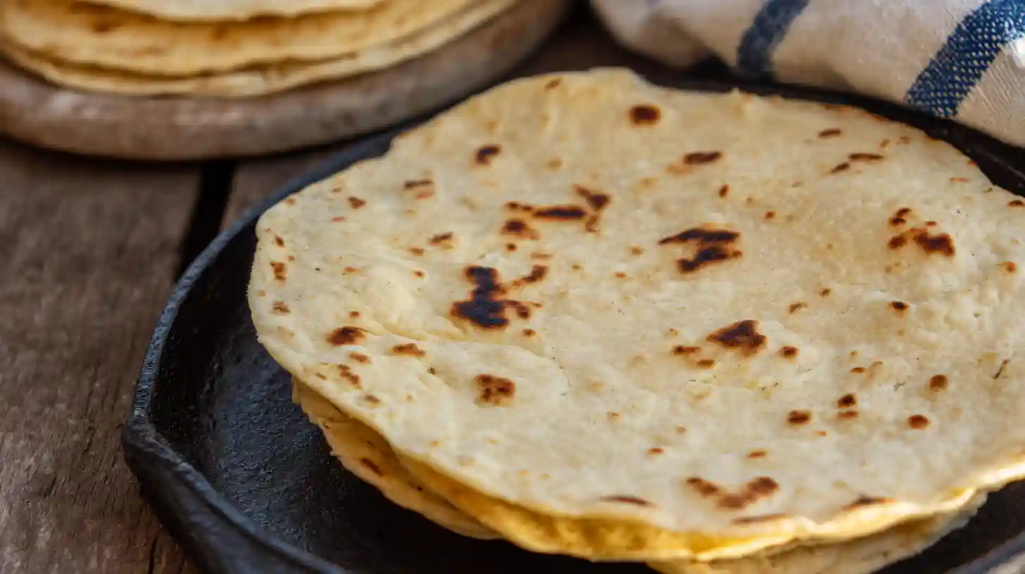 step5-warm-tortillas-teriyaki-tacos Warming tortillas for Teriyaki Chicken Tacos with Grilled Pineapple Pear Salsa – easy dinner recipes for families and quick family dinner ideas.