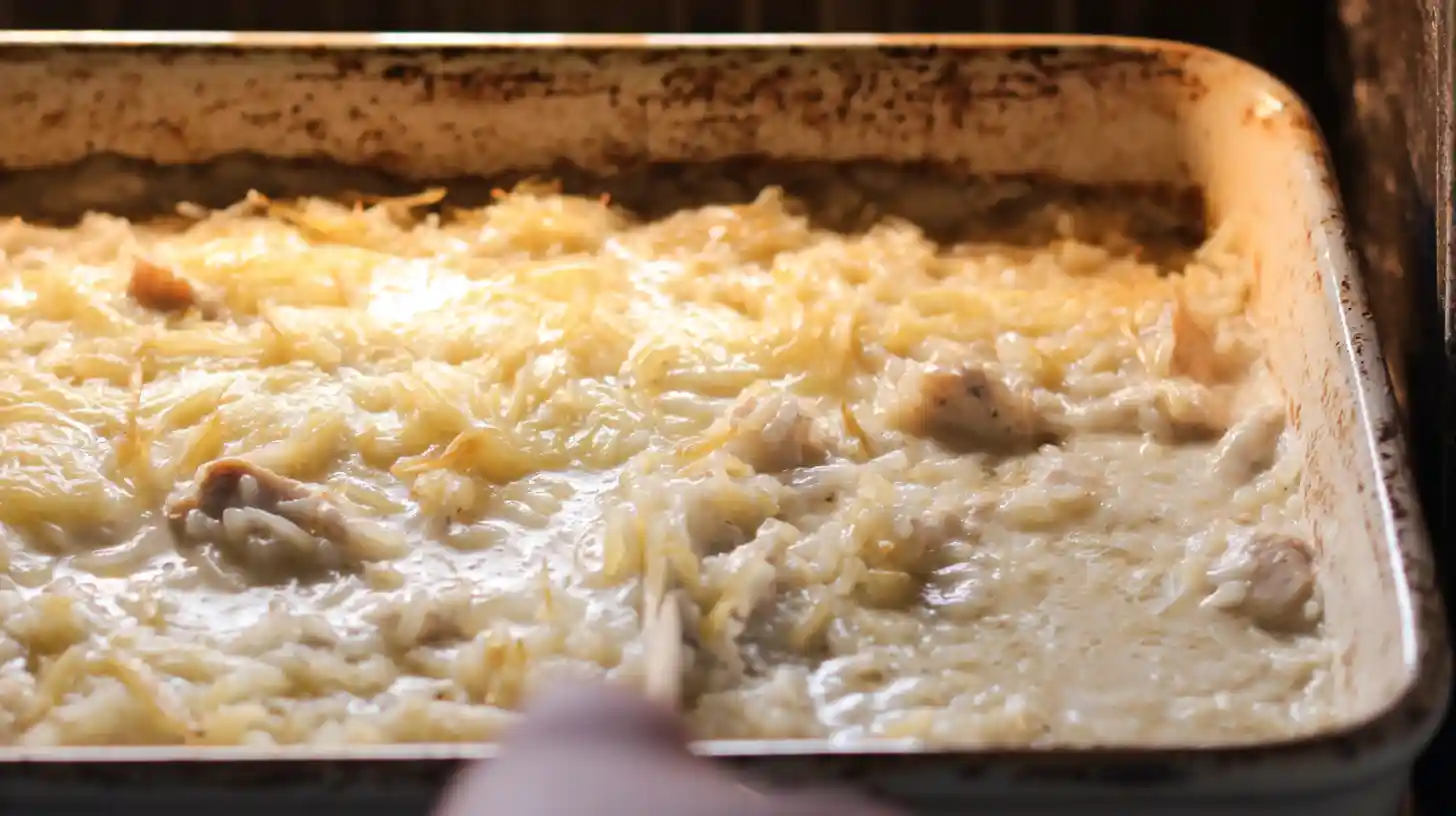 baking-cheesy-french-onion-chicken-casserole-step3 Golden baked cheesy French onion chicken rice casserole bubbling in oven for comfort food dinner