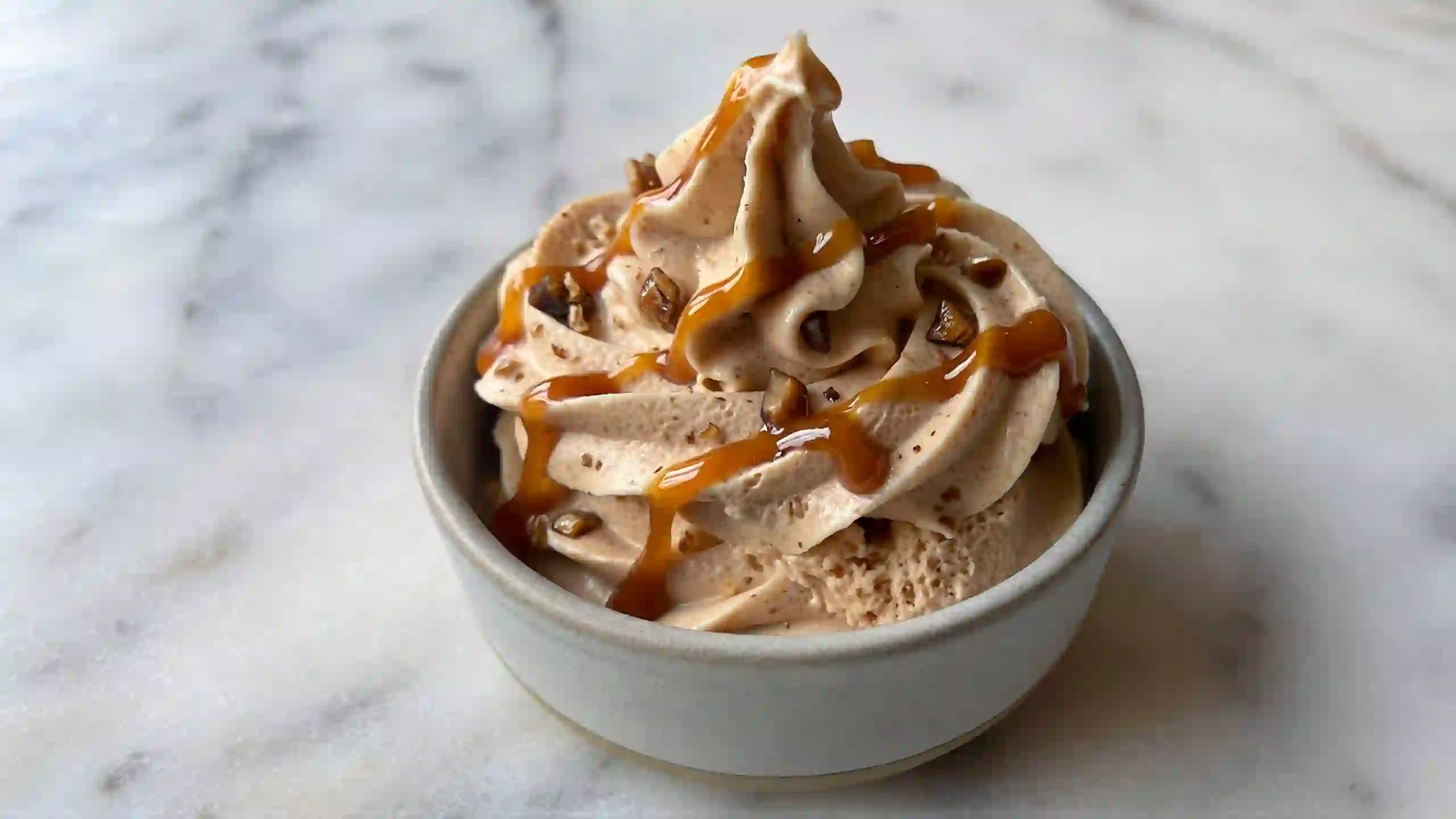 Caramel Toffee Cool Whip topping – rich creamy whipped dessert with caramel sauce and crunchy toffee bits for pies, brownies, and puddings.