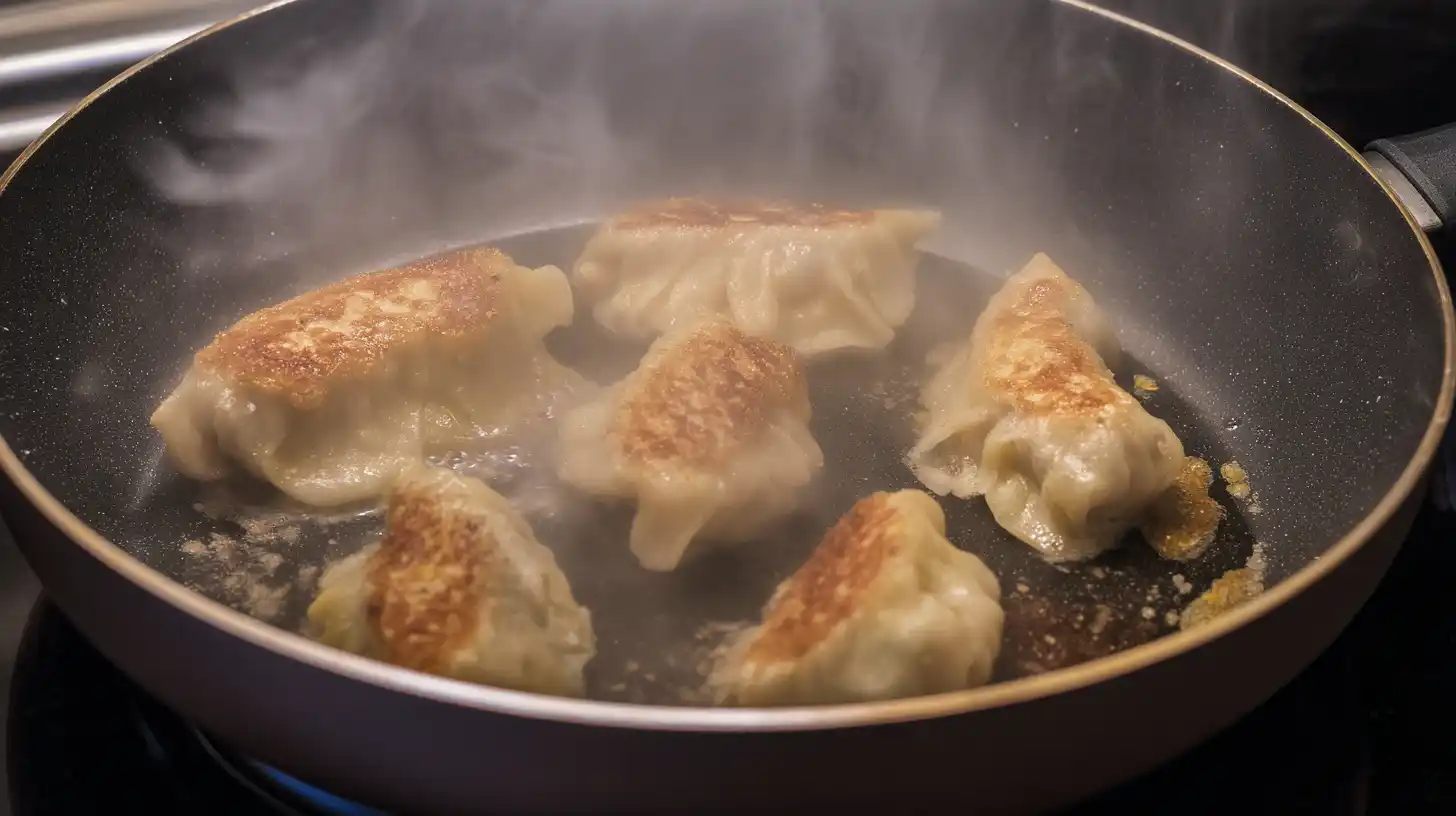 crispy-pan-fried-dumplings-sesame-oil Crispy golden-bottomed pan-fried dumplings steaming in sesame oil for spicy shrimp noodle soup