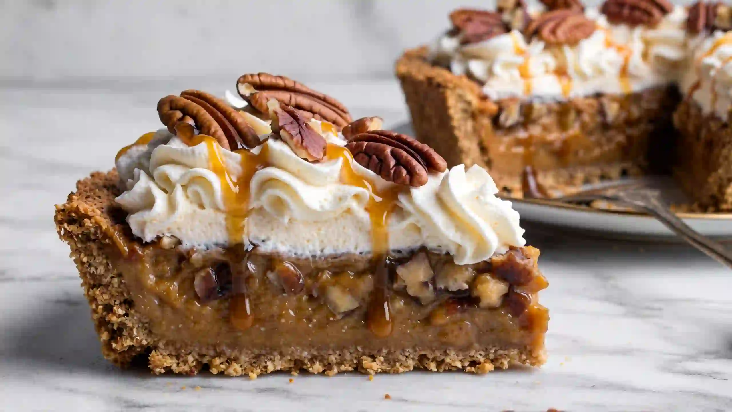 Easy No-Bake Cream Pies .No-bake pecan cream pie slice with graham cracker crust, caramel cream cheese filling, toasted pecans, and whipped cream – easy holiday pie recipe, no oven needed.